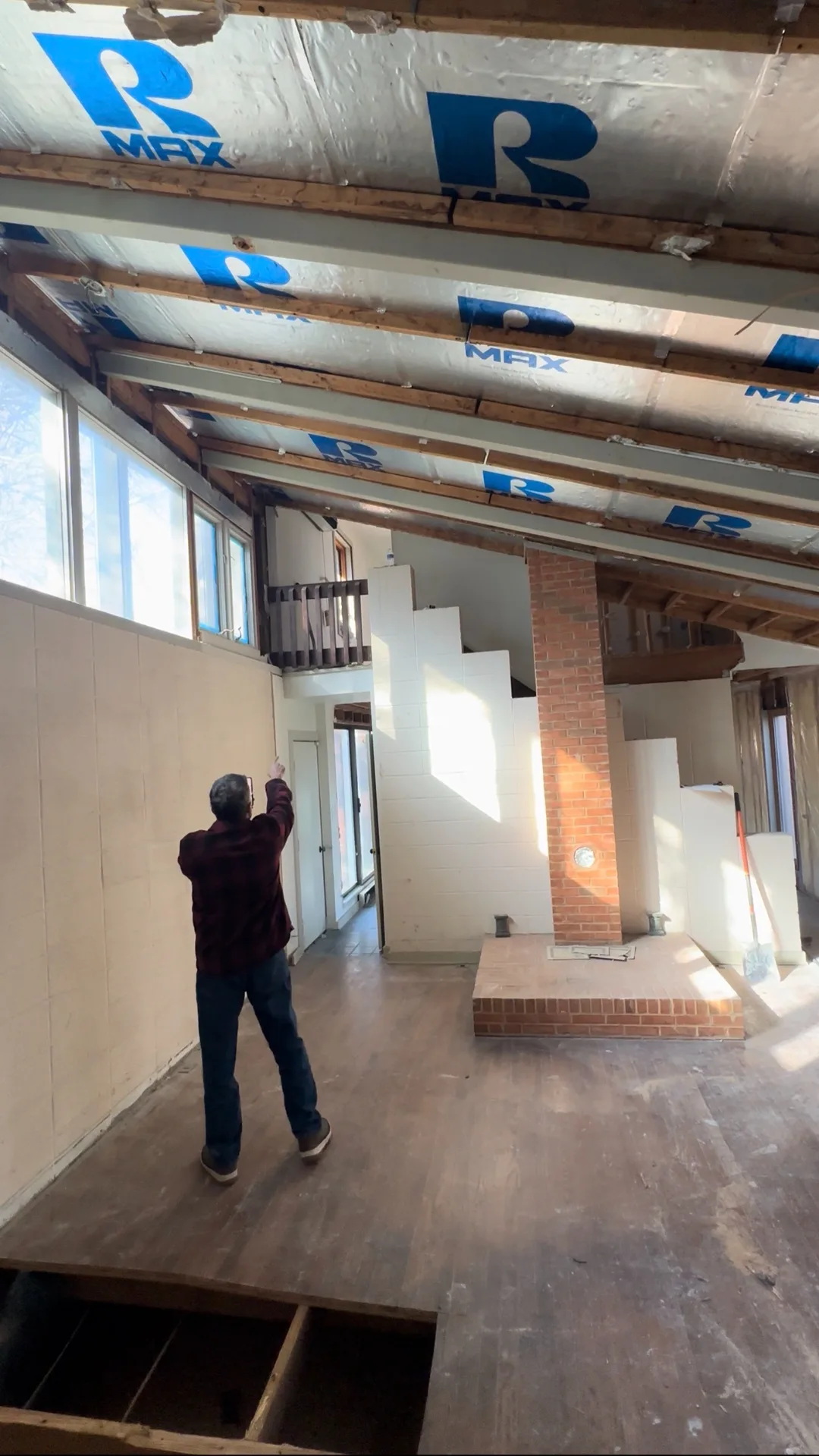 Original vaulted great room with brick chimney column, day one