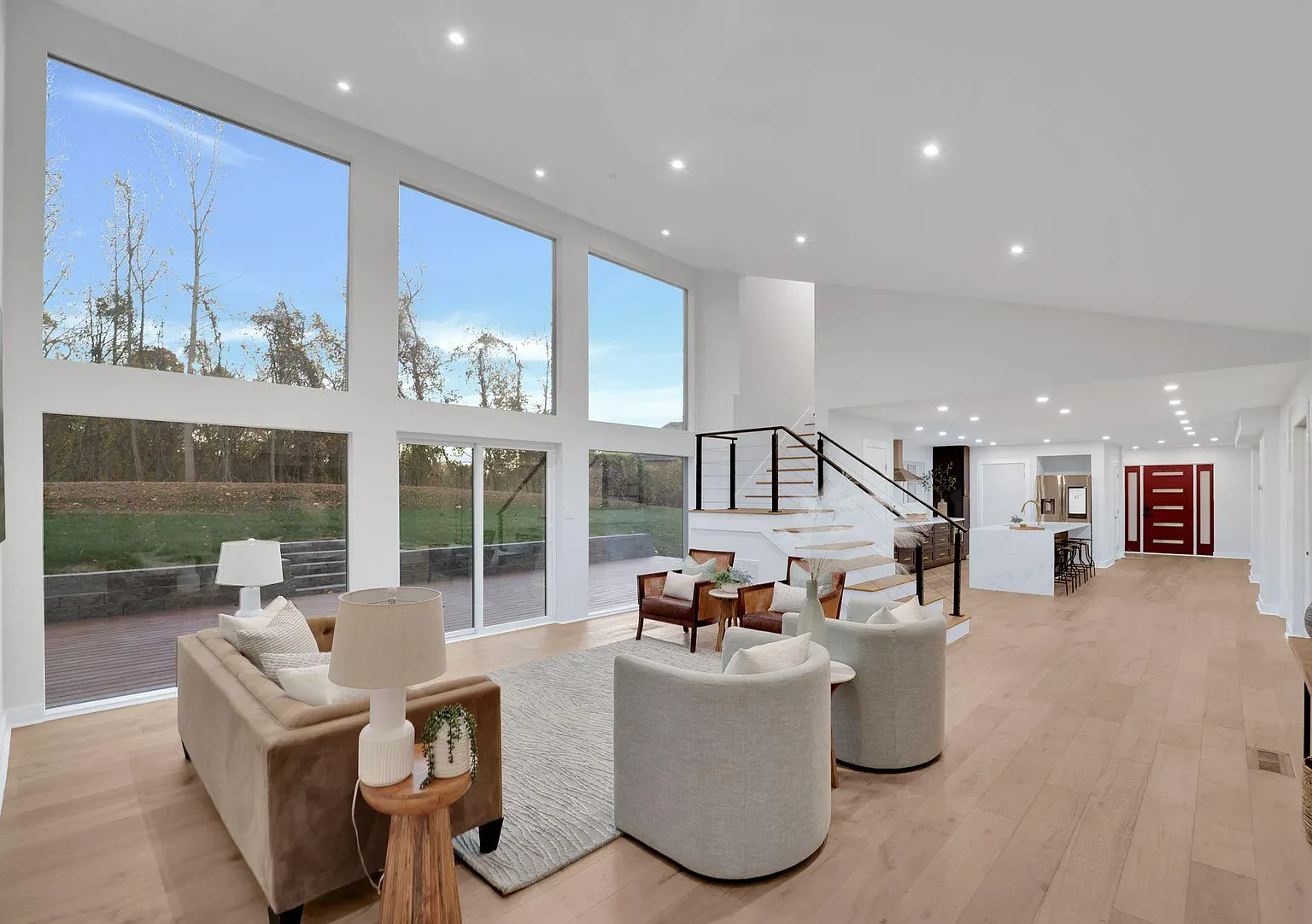5811 Old Crain Highway, Maryland — vaulted great room with floor-to-ceiling windows after a Samantha Allen DMV flip renovation